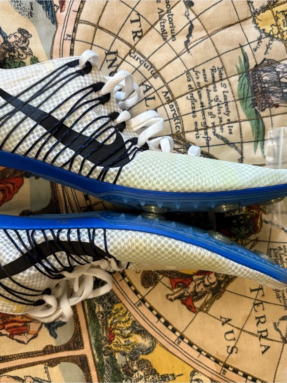 Nike White Sneakers with Neon Green Accents and Blue Outsole